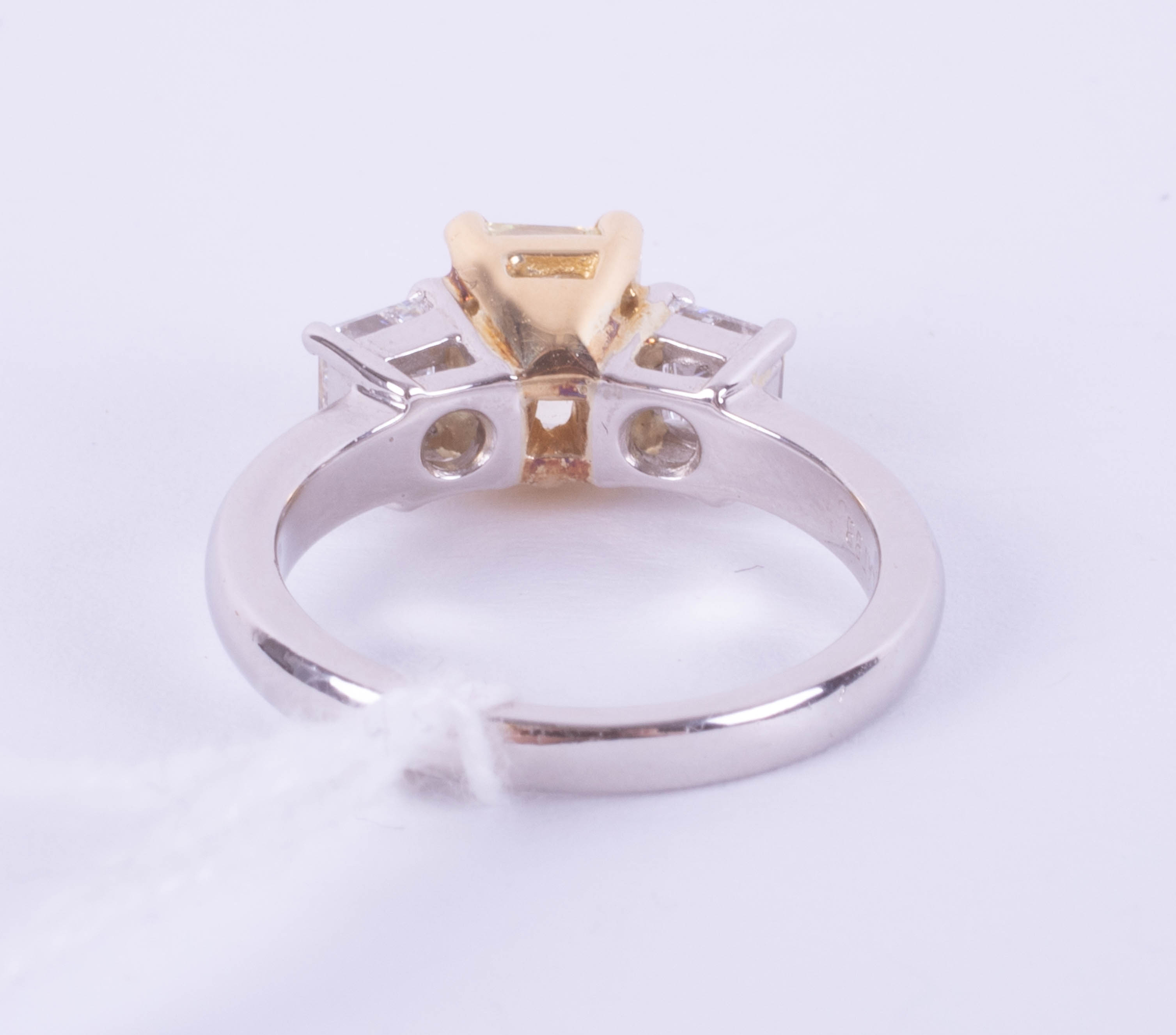 A fine 18ct diamond three stone ring, the centre stone yellow colour, two outer stones princess cut, - Image 6 of 9