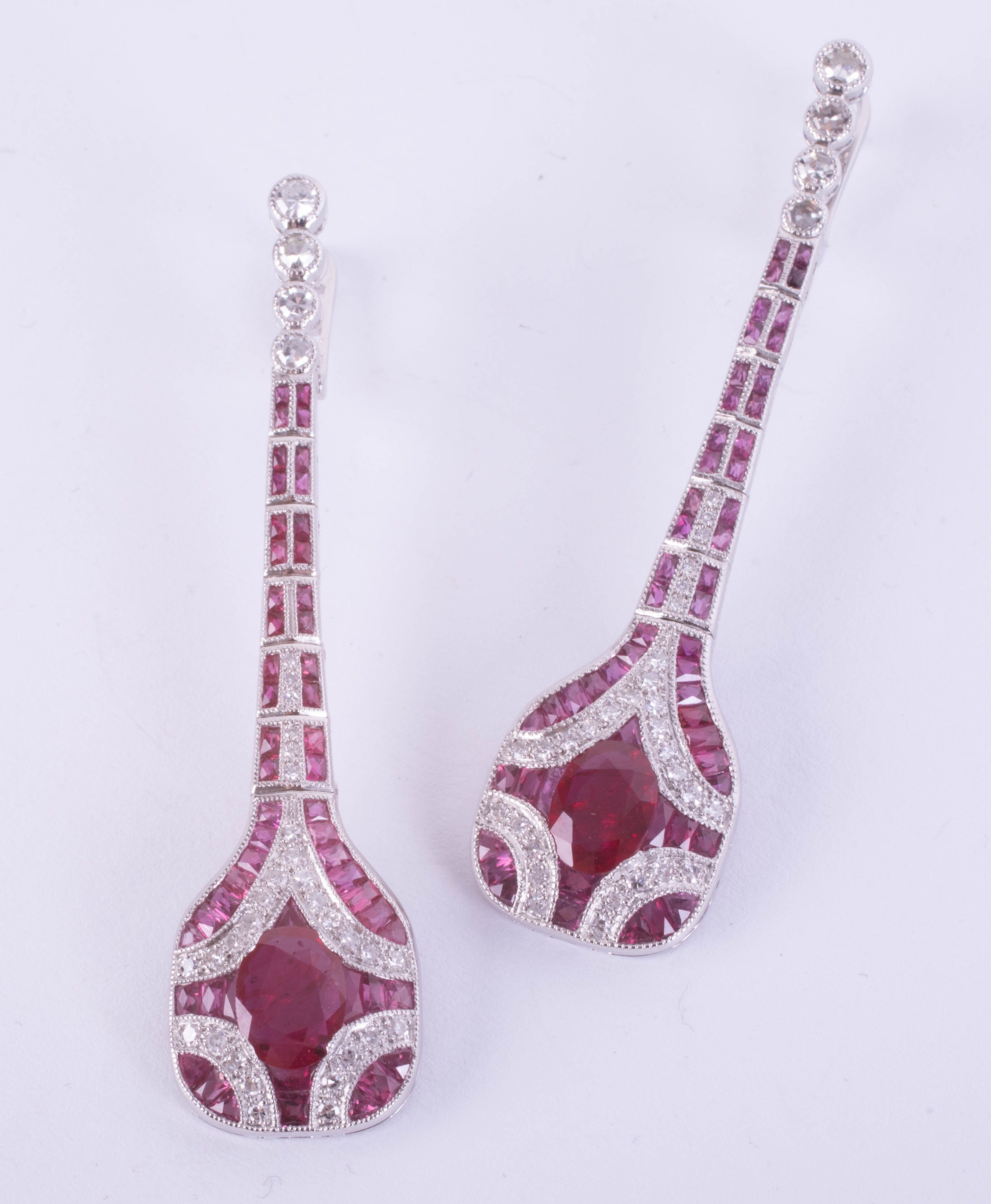 A pair of fine platinum Art Deco-style drop earrings set with rubies and diamonds, boxed.