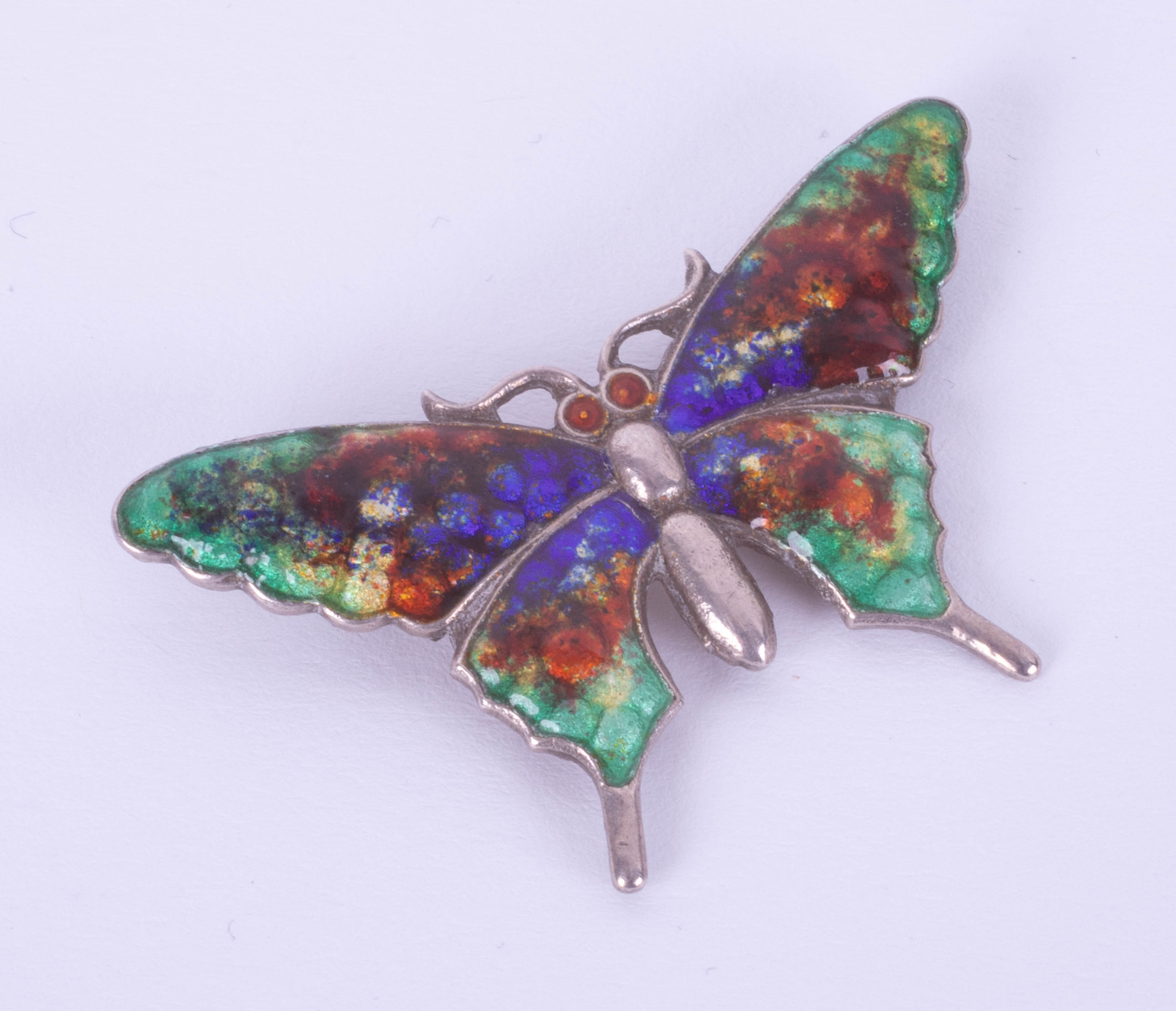 A silver and enamelled butterfly brooch, span 44mm.