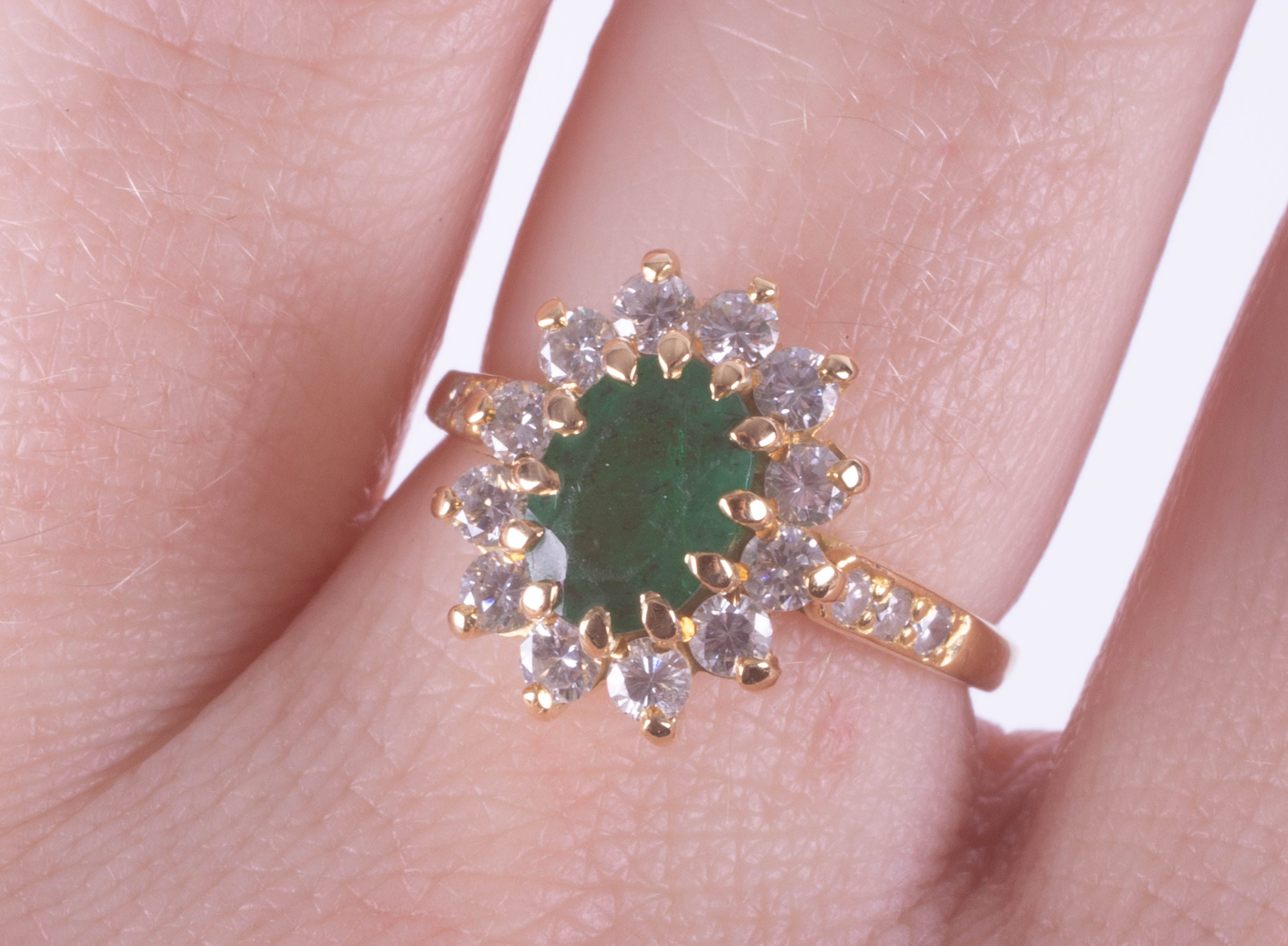 An 18ct yellow gold emerald and diamond oval cluster ring, size L. - Image 2 of 2