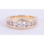 An 18ct diamond set seven stone ring, the central diamond approximately 0.80ct, with a copy of a
