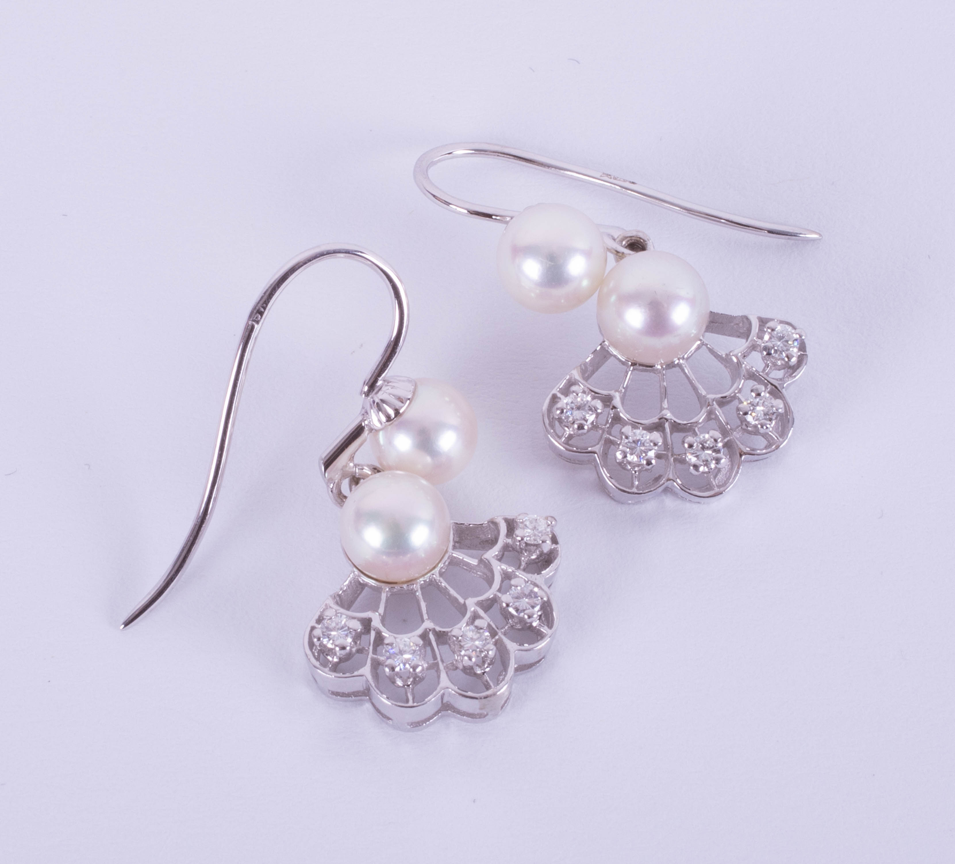 A pair of 9ct white gold diamond and cultured pearl drop earrings with an open wire fitting, total