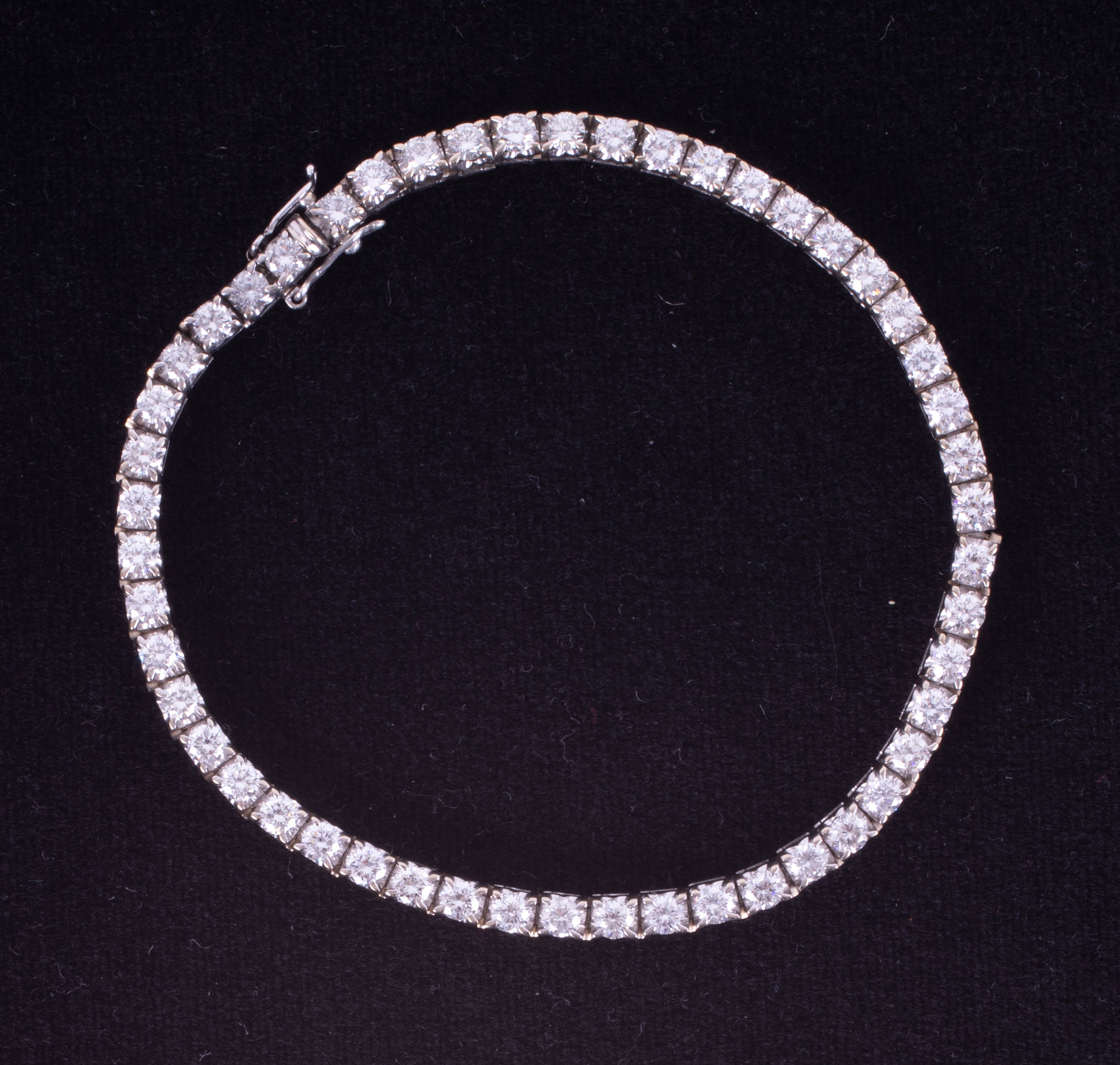 A fine 18ct white gold and diamond set line bracelet, set with fifty diamonds, total diamond