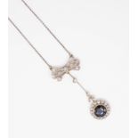 An antique diamond and sapphire pendant necklace with vintage box.