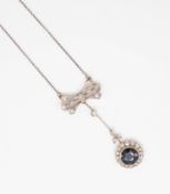 An antique diamond and sapphire pendant necklace with vintage box.