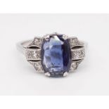 An Art Deco style diamond and sapphire ring, set in white metal, size R.