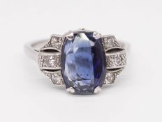 An Art Deco style diamond and sapphire ring, set in white metal, size R.