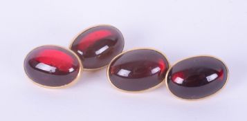 A pair of Edwardian 18ct yellow gold and garnet set cufflinks, 12.80g.