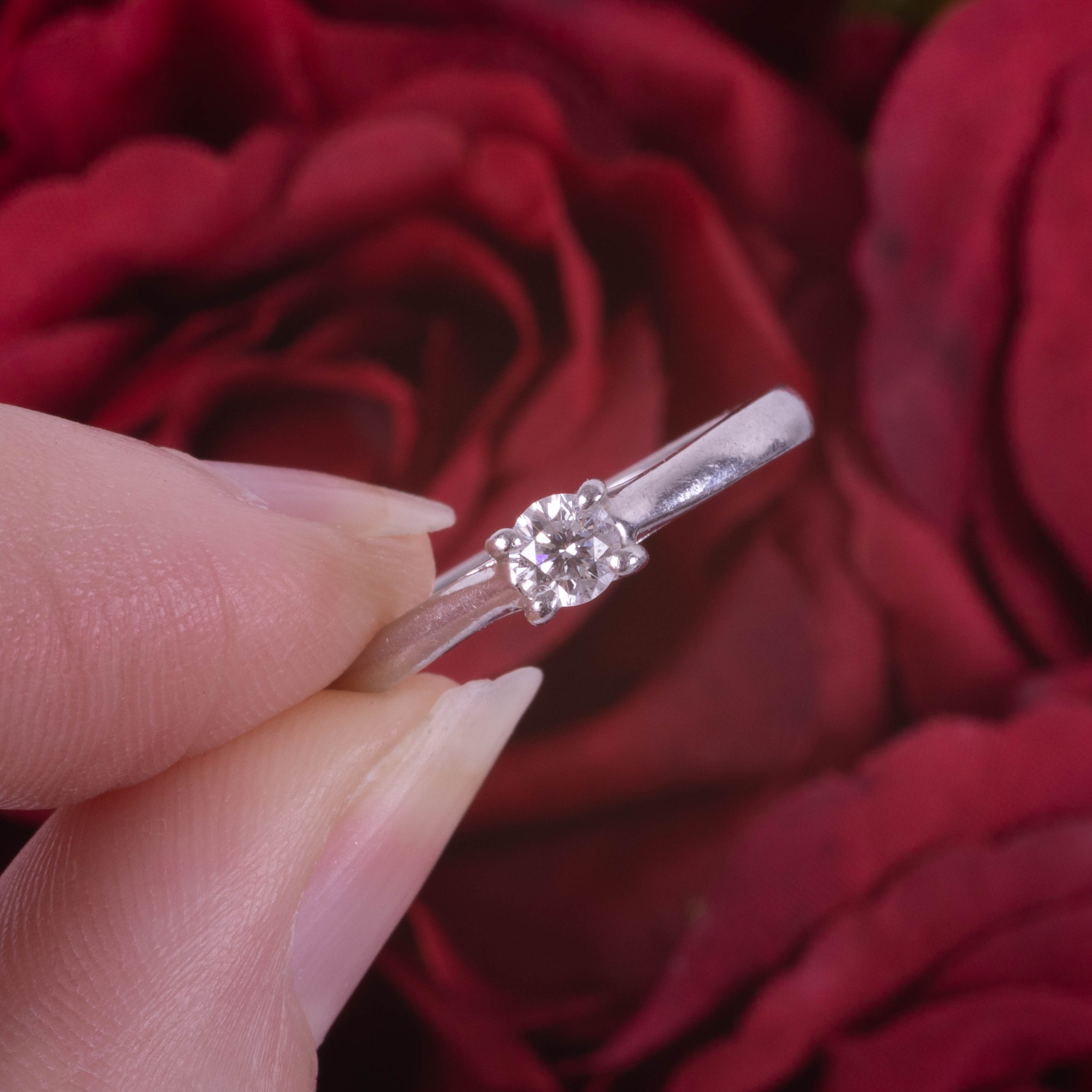 Leo Diamond, a solitaire ring set in platinum with a single diamond, stamped inside the band 0.18 - Image 3 of 5