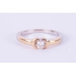 An 18ct diamond set solitaire ring in yellow gold, size L.