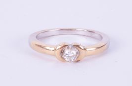 An 18ct diamond set solitaire ring in yellow gold, size L.