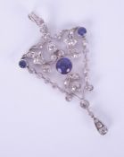 A fine diamond pendant, set with blue stones, overall length 59mm.