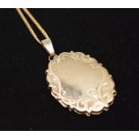 A 9ct gold locket and chain, approximately 11.25g.