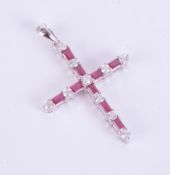 An 18ct white gold ruby and diamond cross pendant.