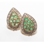A pair of 9ct emerald and diamond pear shaped earrings.