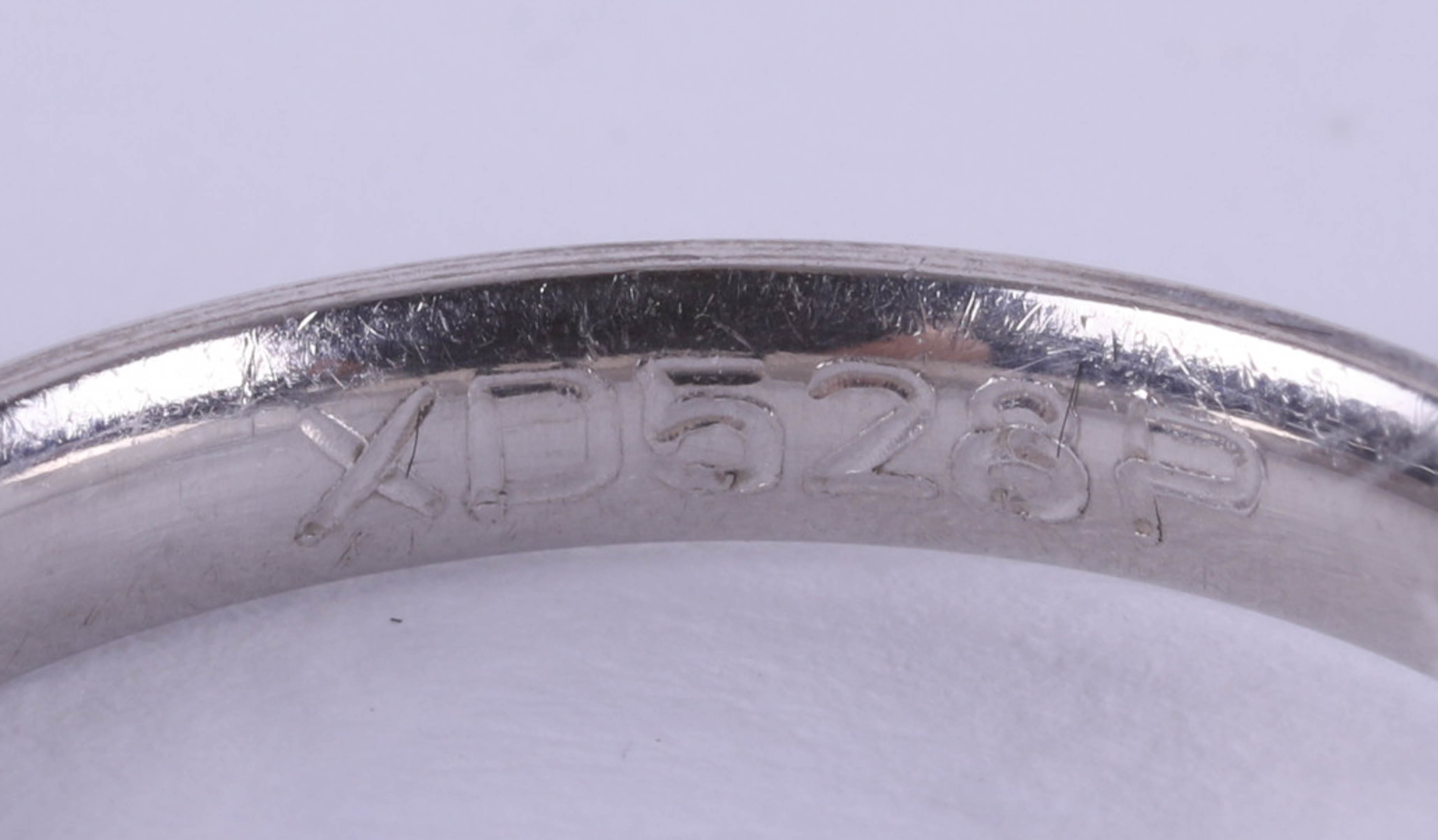 A platinum and diamond set band ring, size N. - Image 4 of 4