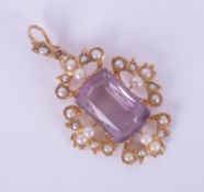 An antique amethyst and pearl set pendant, length excluding drop 27mm.