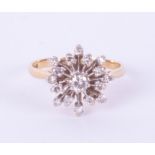 An 18ct diamond cluster ring set in yellow gold, size N.
