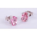 Pair of silver studs set with deep pink tourmaline.