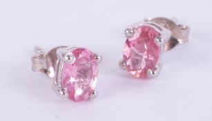 Pair of silver studs set with deep pink tourmaline.