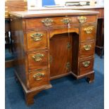 A Georgian mahogany knee-hole desk of small proportions, with brass swan neck handles, width 75cm,