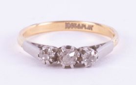 An 18ct and platinum diamond three stone ring, 2.39g.