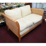 Bergere, a modern light wood, three piece lounge suite, with double cane sides and back.