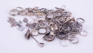 A mixed collection of silver and white metal dress rings, bracelets etc.