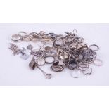 A mixed collection of silver and white metal dress rings, bracelets etc.