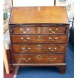 An 18th century mahogany bureau, the fall with a fitted interior over four graduated long drawers