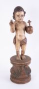 A polychrome carved wood figure of a statue of baby Jesus with orb, height 61cm.