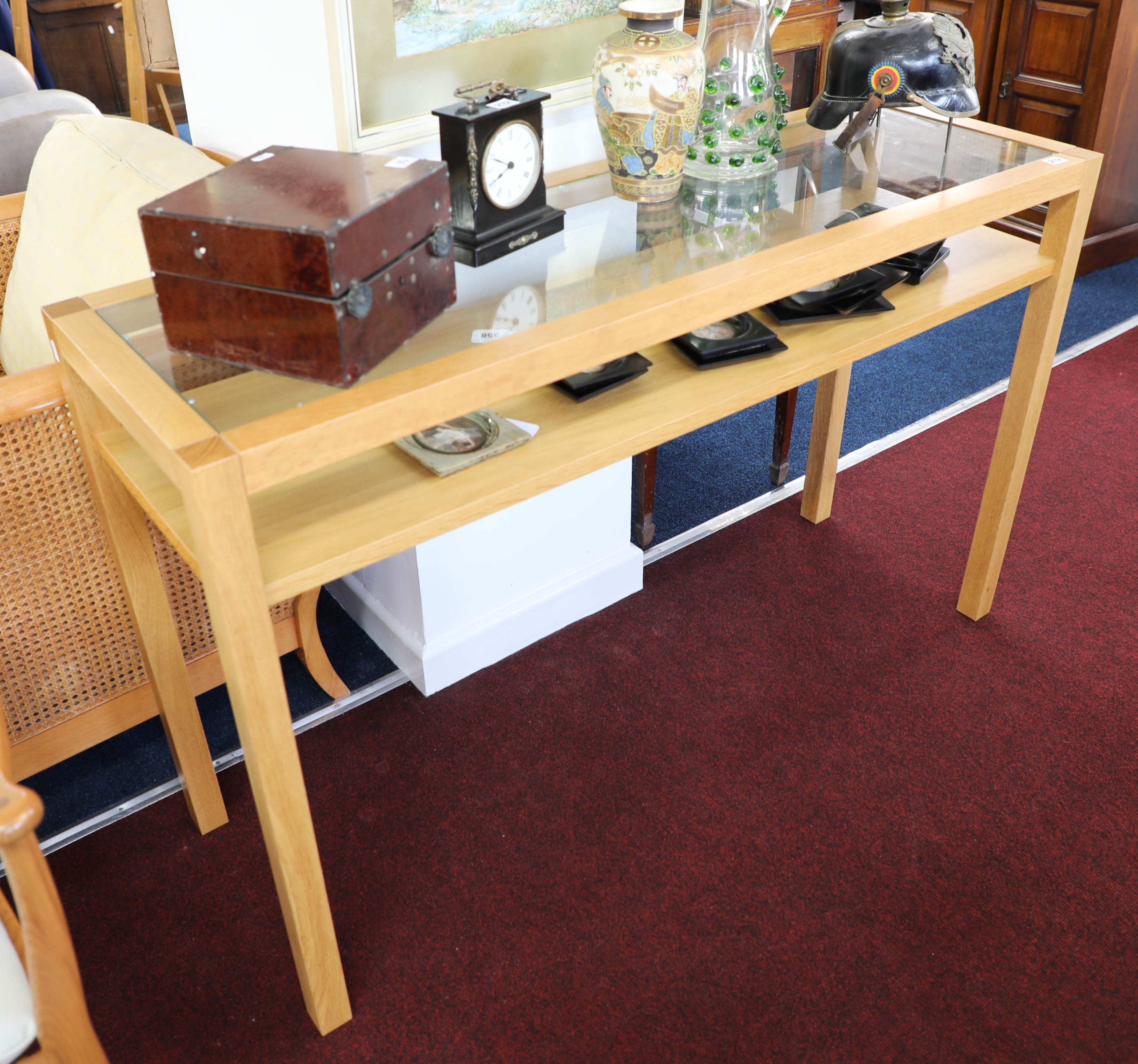 A modern beech framed and glass topped side unit, width 130cm, height 80cm, depth 40cm.