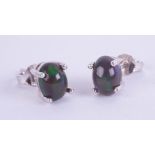 Pair of silver studs set with cabochon black Ethiopian opal.