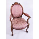 A Victorian mahogany framed elbow chair.