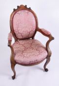 A Victorian mahogany framed elbow chair.