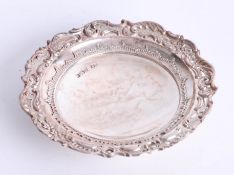A round silver dish with decorative embossed border, round pedestal base, Sheffield maker H.W,