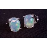 Pair of silver studs set with cabochon white Ethiopian opal