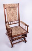 An Edwardian mahogany framed rocking chair.