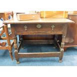 An antique oak side table, fitted with a single drawer on turned legs with stretchers, width 90cm.