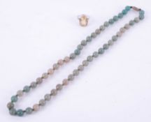 A silver and large citrine dress ring and a jade style bead necklace, length 54cm.