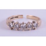 A 9ct five stone diamond ring set with old brilliant cut diamonds (the ring band cut), size L.