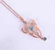 A 9ct gold pendant on chain of Art Nouveau style.