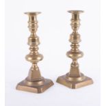 A pair of 19th century brass candlesticks, height 27cm.