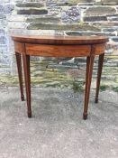 A Georgian mahogany foldover games table.