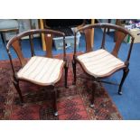 A pair of mahogany framed corner chairs.