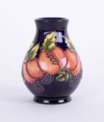 Moorcroft, small vase, Peaches pattenr, on blue ground, 10cm height.