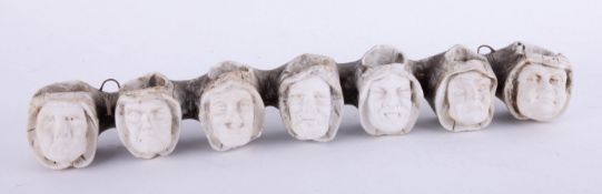A clay pipe stand in the form of the Seven Deadly Sins, length 28cm.