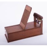 An antique mahogany cotton/wool winding machine, length 30cm, height 27cm.