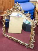 A reproduction gilt framed mantle mirror.