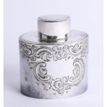A silver oval tea caddy with lift off top, embossed scroll decorated body, Sheffield maker H.A.,
